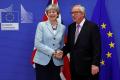 Brexit Phase I. Britain's Prime Minister Theresa May is welcomed by European Commission President Jean-Claude Juncker at the EC headquarters in Brussels