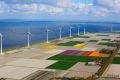 Wind turbines on land reclaimed from the sea.